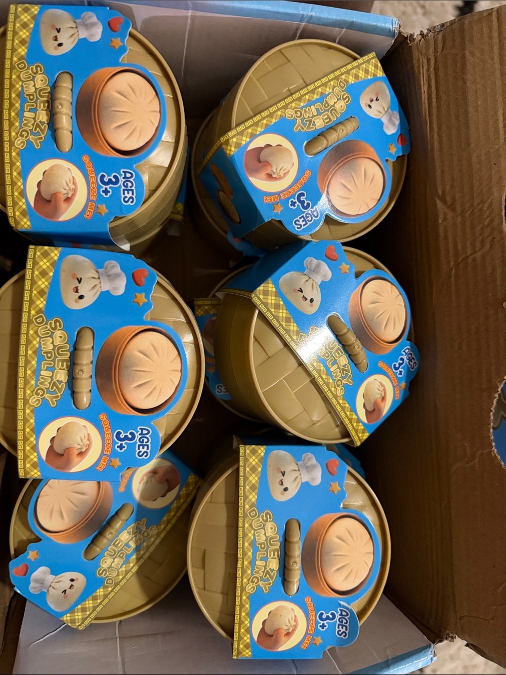 Squeezy Dumpling Toy - Light Tan & Blue Packaging